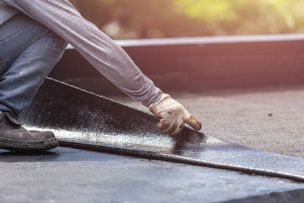 Professional Basement Waterproofing technician working in Forest, IN